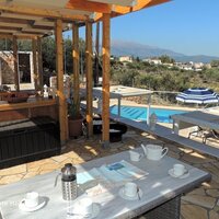 12 Kallithea lounge and dining terrace with view to mountains, small barbeque, cloak room and shower room.